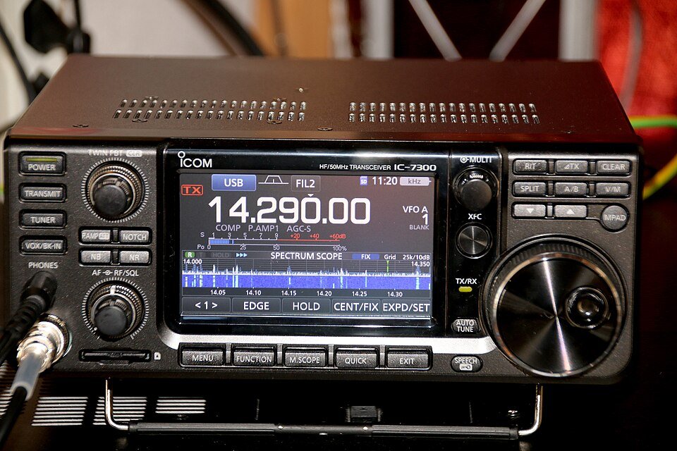 An Icom IC-7300 HF and 50 MHz transceiver on a desk.